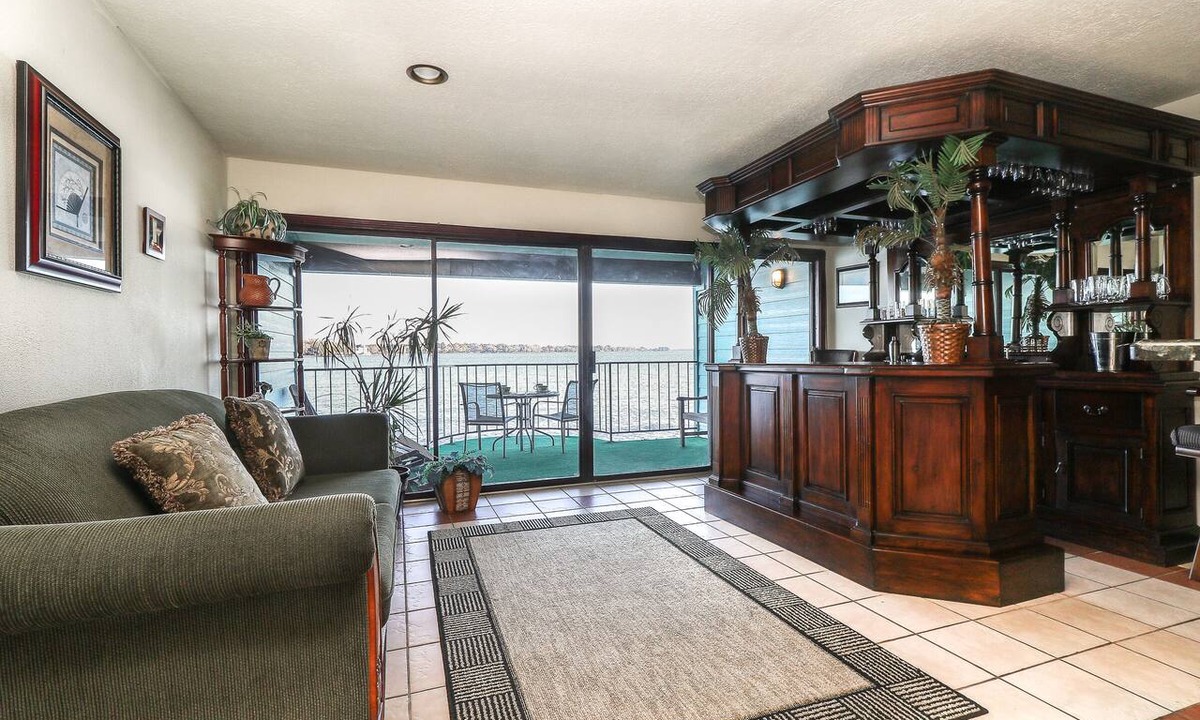 Seven Coves Condo | 1 Bedroom with a Private Waterfront Balcony and a One-of-a-Kind Bar