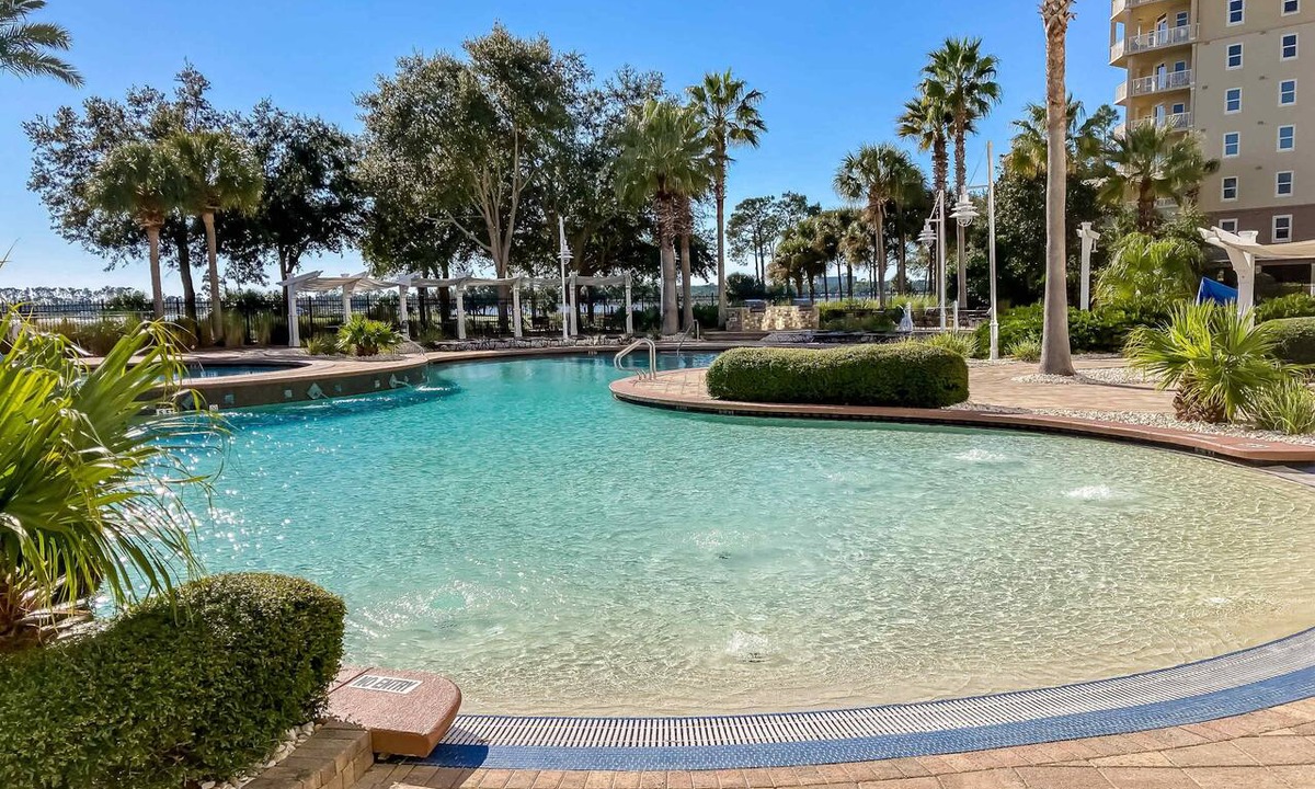 Upper Grand Lagoon Condo | 3rd-floor beach & pool-view condo with outdoor pool, hot tub, grills, balcony