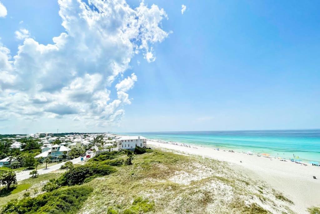 Sunnyside House | Beachfront condo in gated resort with pools lake access fast WiFi & patio