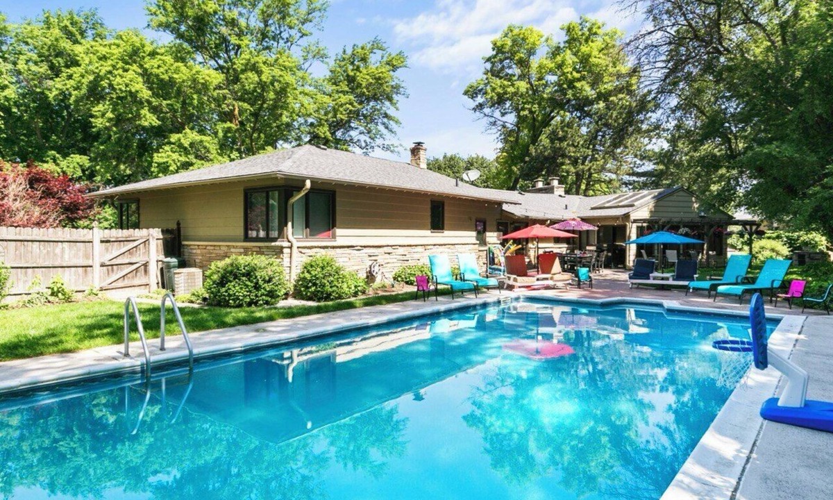 West Omaha House | Central Omaha Pool with Spa Oasis + 3 Living Rooms