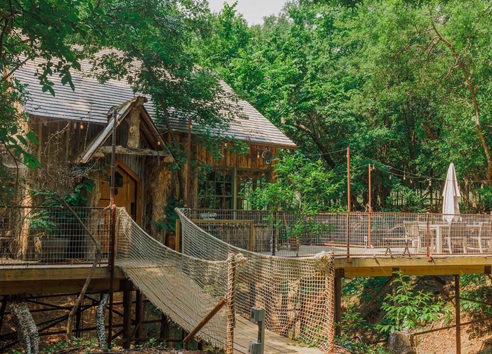 Dennis Ski Chalet | Hobbit Treehouse with waterfall on the Brazos River! 350 acres! Tubing! Petting zoo!