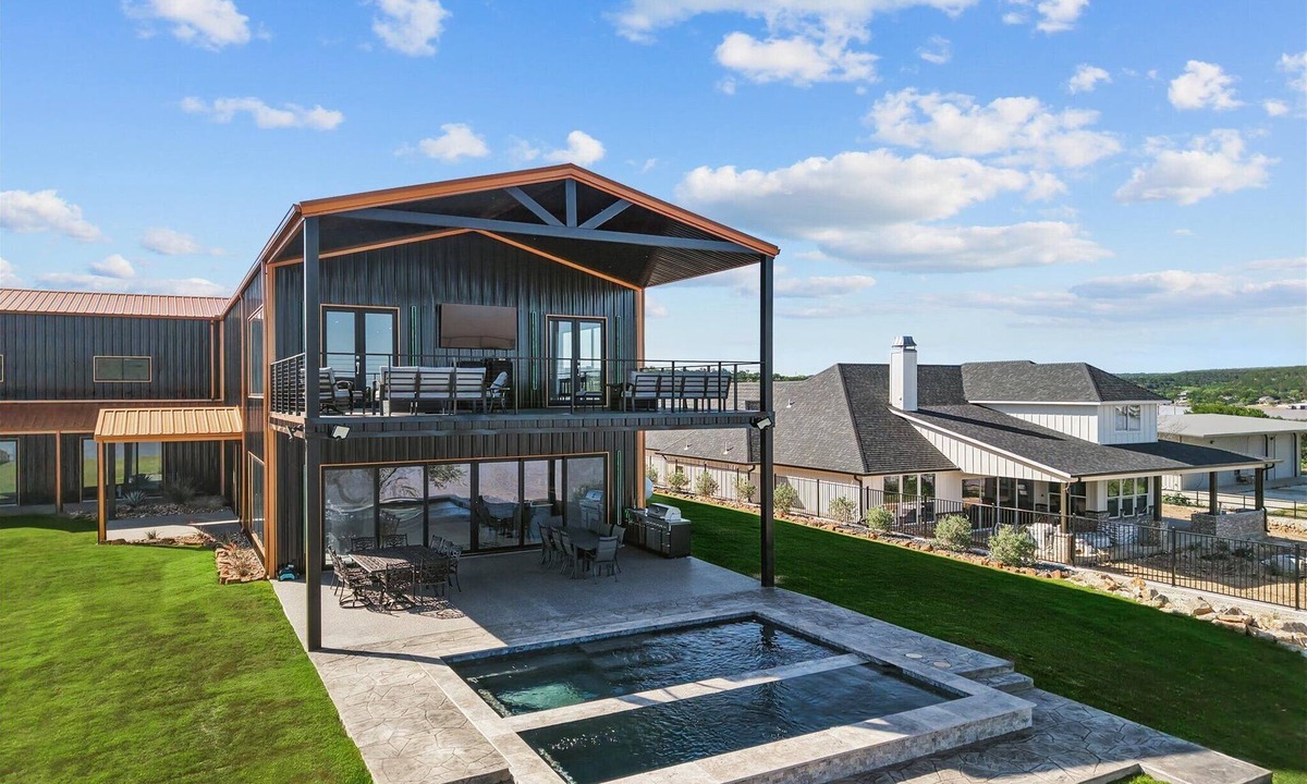Graham House | Lakefront resort home. Sleeps 26+! Boat dock, kayaks, pool, hot tub & more!