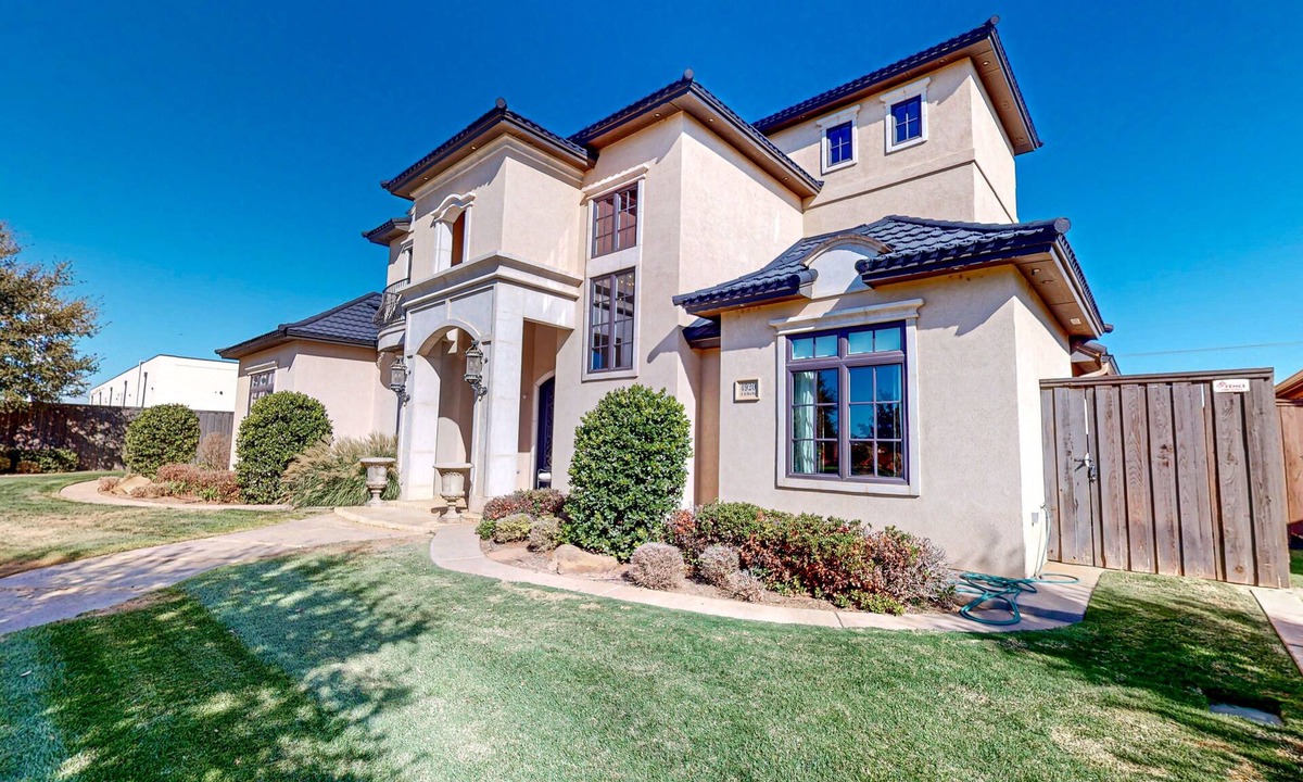 Lubbock House | Luxury home with private pool, waterslide, grill, home theater, & office