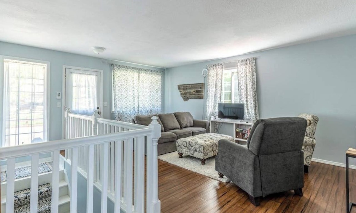 Woods Bay House | Mountain-view home with large deck, gas grill, firepit, lawn, and central AC