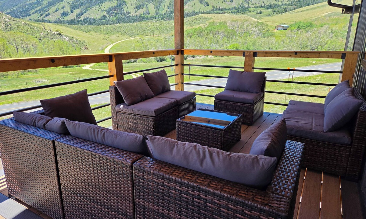 Centennial House | Pine & Peak Lodge in Centennial, WY Patio Seating & Game Area -No cleaning fee-