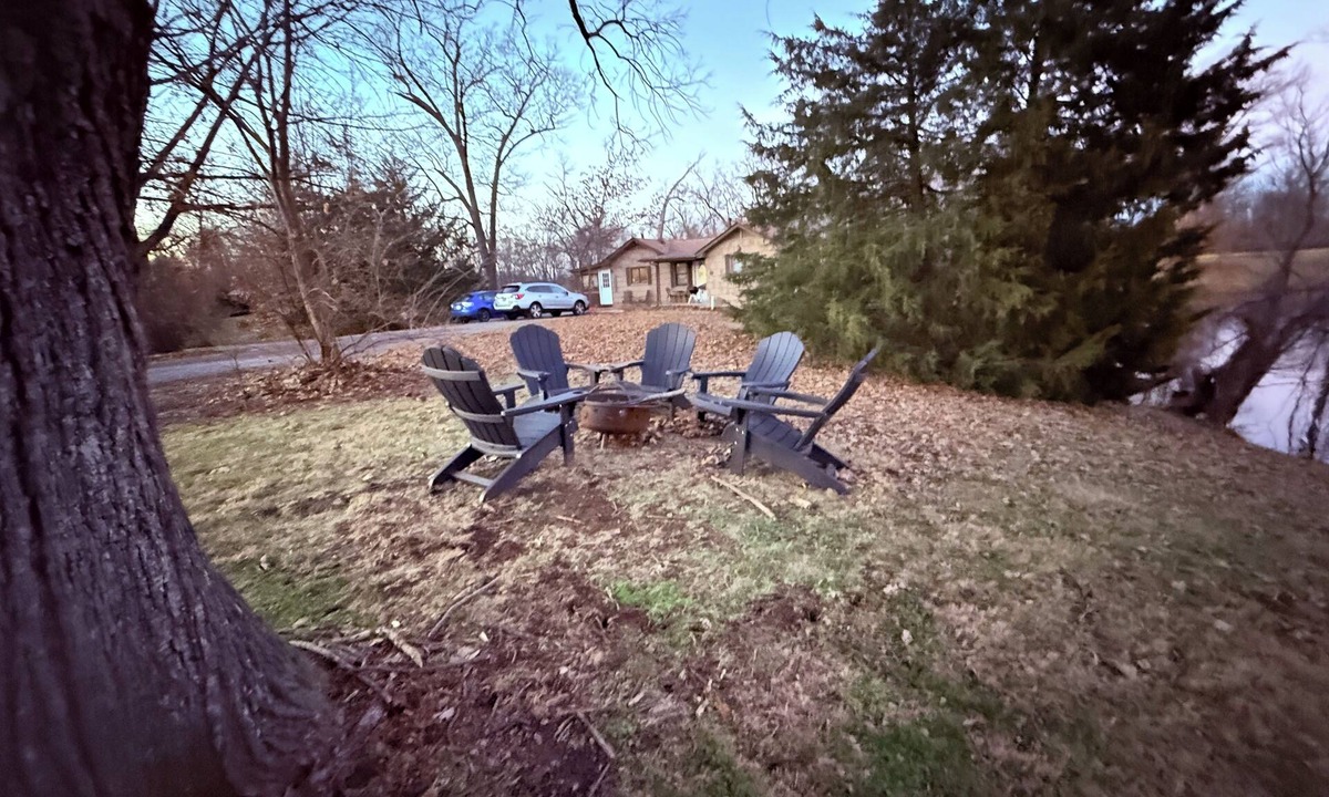 Caseyville Apartment | Private one-bedroom suite with king bed, walk-in closet, and ensuite bath featuring double vanity and safety grab bars. Enjoy serene pond views from your patio, full kitchen, and dedicated workspace for a comfortable stay.