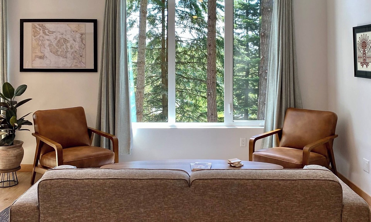 Rosario House | Stylish forest retreat on Orcas Island. Chef's kitchen, mid-century décor & a private deck among the firs. Two levels, forest views from every room. Minutes to Moran Park, Rosario Resort & Eastsound. Your perfect Pacific Northwest escape awaits.