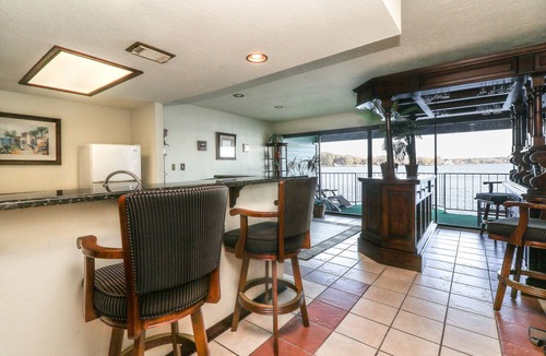 Seven Coves Condo | 1 Bedroom with a Private Waterfront Balcony and a One-of-a-Kind Bar