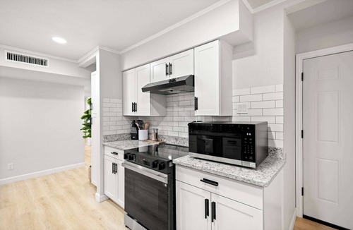 Grand Prairie House | 5-BD/2.5-BA Modern Retreat w/Games & Hot Tub