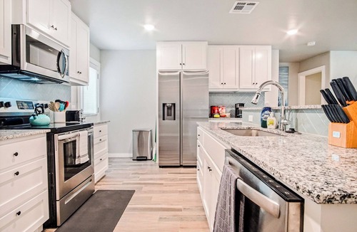 Central Oklahoma City House | 5BR Bethany home near Wiley Post & SNU. Hot tub, full kitchen. Sleeps 12. #COL