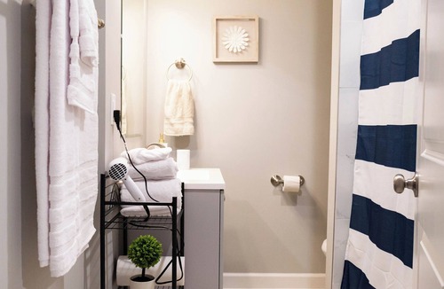 Shawnee Apartment | A charming bedroom with a king bed in quiet Shawnee neighborhood near highways.