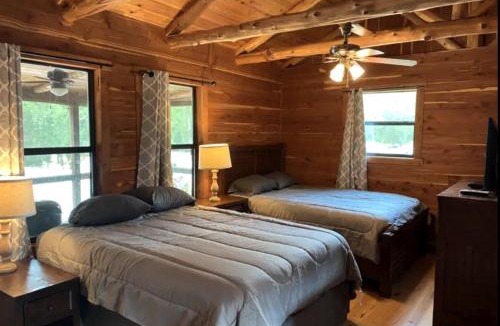 Prairie Lea House | A Rustic Log Cabin - Perfect for a Glamping Getaway by the San Marcos River near Kingsbury, Texas