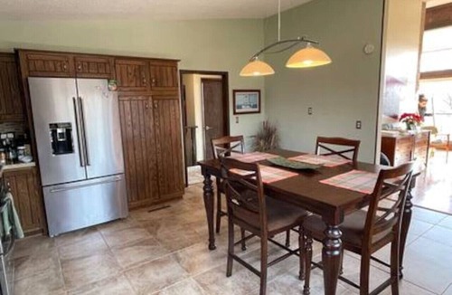 Altoona House | Beautiful Home in Town Acreage