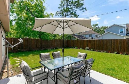 MacGregor House | Bring the Crew! 4BR Luxe Pad, Backyard Magic & City at Your Door