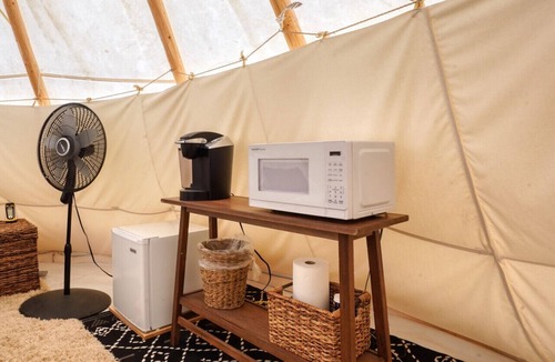 Hot Springs RV Rental | Buffalo Glamping Tipi with King Bed in Black Hills