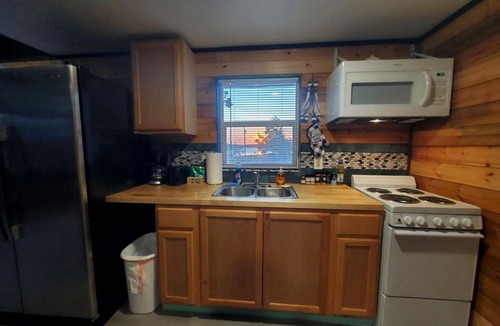 Cisco House | Charming Lakefront Cabin with Sandy Beach Access & Fire Pit Near Lake Cisco, TX