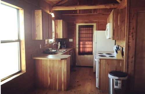 Prairie Lea Cabin | Charming Log Cabin in Texas - Perfect Glamping Vacation on the San Marcos River near Kingsbury