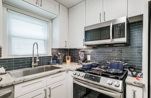 Shady Acres House | Charming private home sleeps 6 in the Heights near Downtown with fast WiFi, smart TVs, ample parking, and a primary king bed for a comfortable stay.