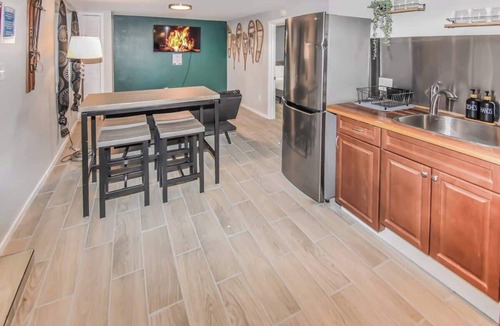 Southeast House | Cozy basement space with 2 bedrooms and kitchenette