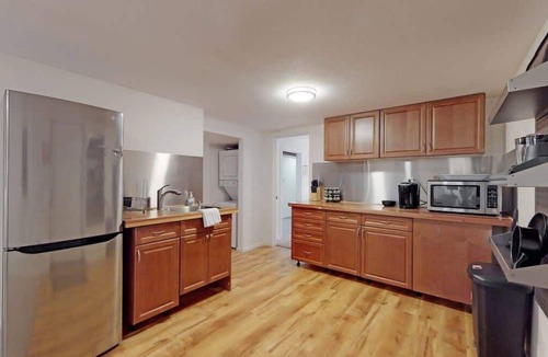 Southeast House | Cozy basement space with 2 bedrooms and kitchenette