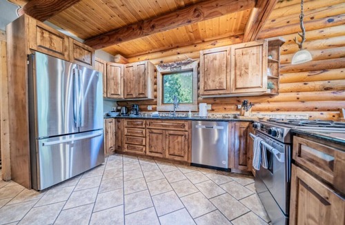 Carriage Hills Cabin | Creekside cabin with hot tub, views, fireplace