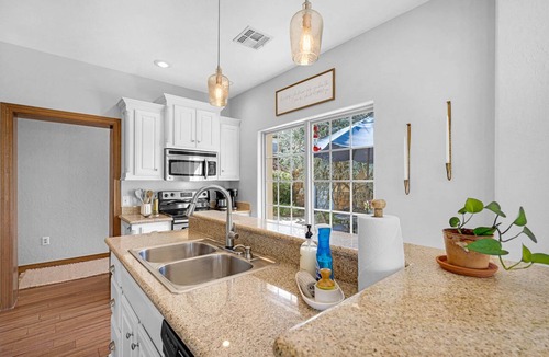Medicine Park House | Creekside Retreat with Hot Tub, Walk to Downtown Medicine Park, Sleeps 12
