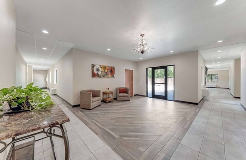 Eastside Promise Neighborhood Hotel | Enjoy Comfort in a Cozy Room w/Convenient Amenities - Perfect for Any Stay