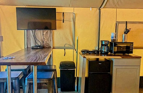 Prairie Lea RV Rental | Fully-Equipped Riverside Glamping Safari Tent on the San Marcos River, Texas