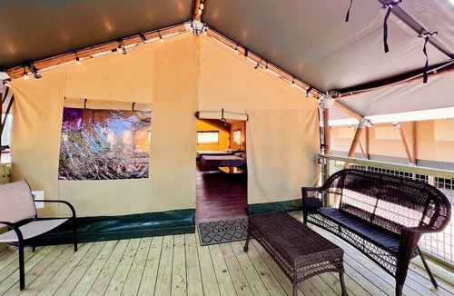 Prairie Lea RV Rental | Fully-Equipped Riverside Glamping Safari Tent on the San Marcos River, Texas