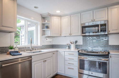 Bremerton House | Gorgeous Waterfront home sleeps 6! Outdoor fireplace, HOT TUB & a large yard!