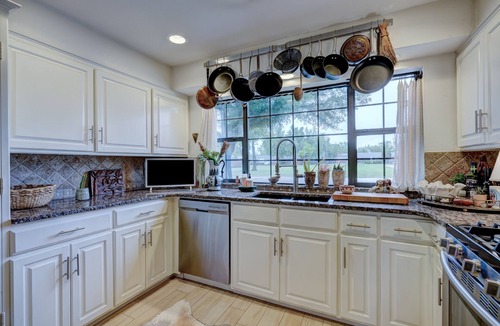 Central Oklahoma City Villa | Historic Villa🚶1 min from Lake Hefner🏊 Hot Tub 🎱Pool Table🐶Friendly🎣Fishing