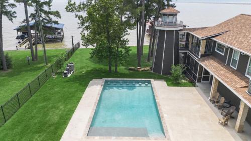 Onalaska House | Huge lakefront retreat with private pier, pool, game room and outdoor fire pit