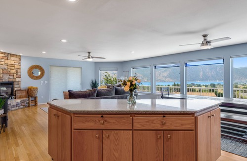 Manson House | Lake & mountain view home with hot tub, pool, 2 decks, game room, & fireplace