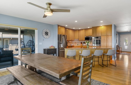 Manson House | Lake & mountain view home with hot tub, pool, 2 decks, game room, & fireplace