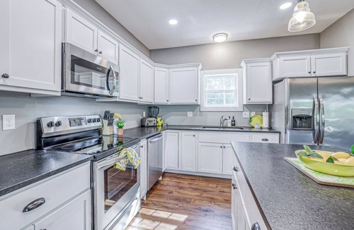Linn Valley House | Lakefront, private swim dock, kayaks, paddleboards, grill, 1 hour from KC.