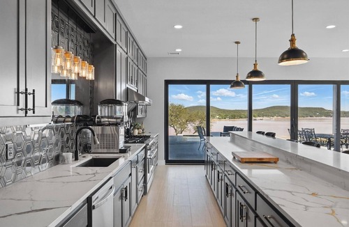 Graham House | Lakefront resort home. Sleeps 26+! Boat dock, kayaks, pool, hot tub & more!