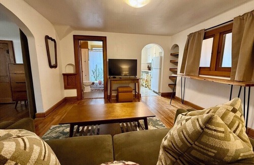 North of Grand Apartment | Lofted Lounge - Cozy Treetop Hideaway w/Sunny Deck