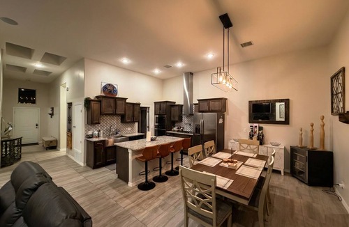 Biggs Field House | Luxurious El Paso Oasis: Modern 5BR, Huge Patio with Kitchen, TV, & Lounge Area