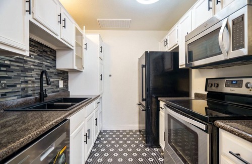 Vickery Meadow Condo | Modern 2 bedroom with 2 fire places and a 9 mile walking/biking trail