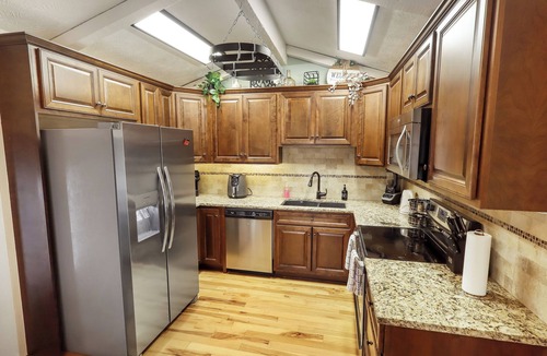 Chalco House | Modern 4BR Omaha, Fenced Yard, Desks in Every Room, W/D, Pet-Friendly