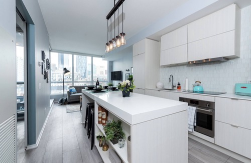 East Village House | Modern Rustic Hometel | 2BR 1BA | Smart home in DT