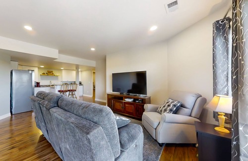 Fort Collins House | Newly built walkout basement with water views, patio, & Ping-Pong table