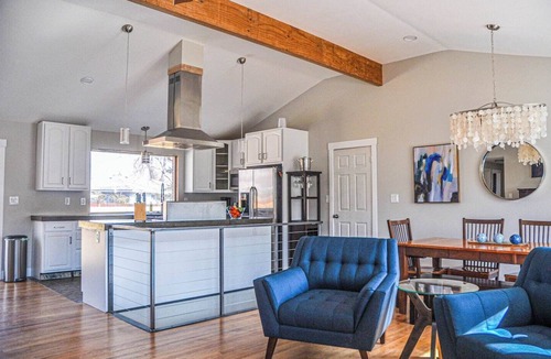 Martin Acres House | Our comfortable home, with great view of the Flatiron Mountains, sits in the heart of South Boulder. Enjoy the private hot tub spa, media room with 84" Theater TV, well stocked Chef's kitchen. Walk to shopping, restaurants, brewery and trails nearby.