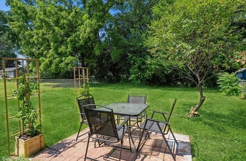 Greater South Side House | Pet & family friendly 4-bedroom house, sleeps 10. Close to DSM Airport!