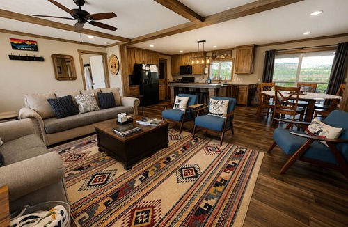 Marvel House | Riverfront Home with Hot Tub, AC, Large Deck