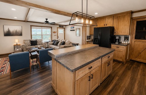 Marvel House | Riverfront Home with Hot Tub, AC, Large Deck