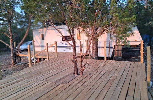 Gordon House | Secluded RV on mountain bluff on lake Palo Pinto, large deck. Bike,boat andswim.