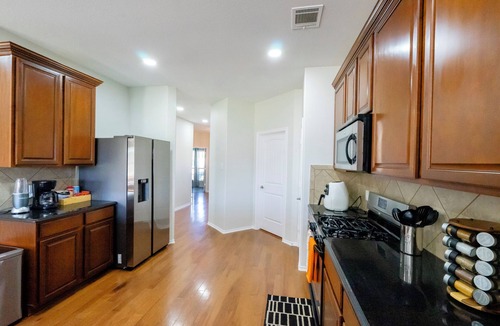 McKinney House | Serene 4-bedroom house with BBQ, 5-TVs in McKinney facing Park & Pond sleep 12