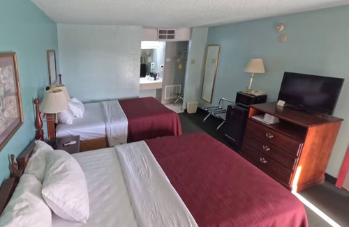 Vega Hotel | Simple, Clean & Comfy 2 Queens Room Perfect for Texas Panhandle Travelers