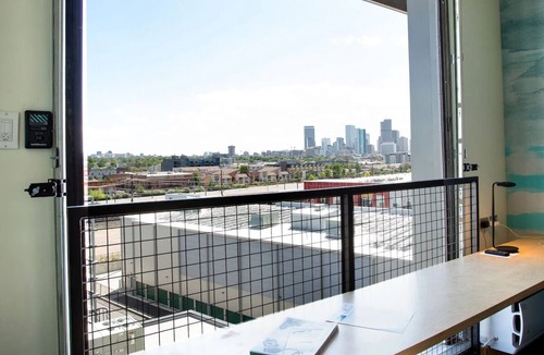River North Art District Hotel | Spacious Industrial Loft with Stunning Views and Unique Garage Door Feature